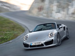 Porsche 911 Turbo Cabriolet (2013). Выпускается с 2013 года. Две базовые комплектации. Цены от 12 629 000 до 14 263 000 руб.Двигатель 3.8, бензиновый. Привод полный. КПП: роботизированная.